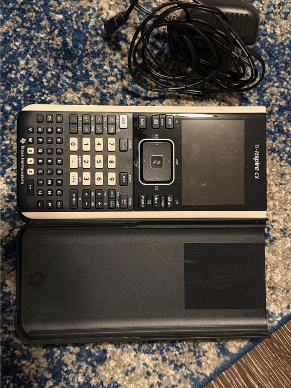 TI-Nspire CX Graphing Calculator in Black and Silver